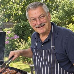 Werner laughing at the grill, an uploaded family photo
